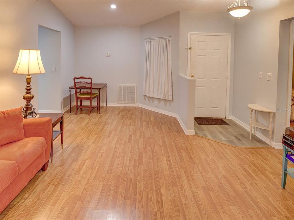 Living room with view of the dining room.