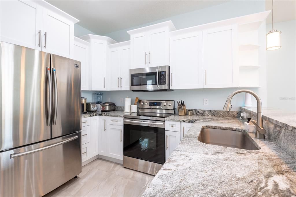 granite counter top kitchen with stainless steel appliances