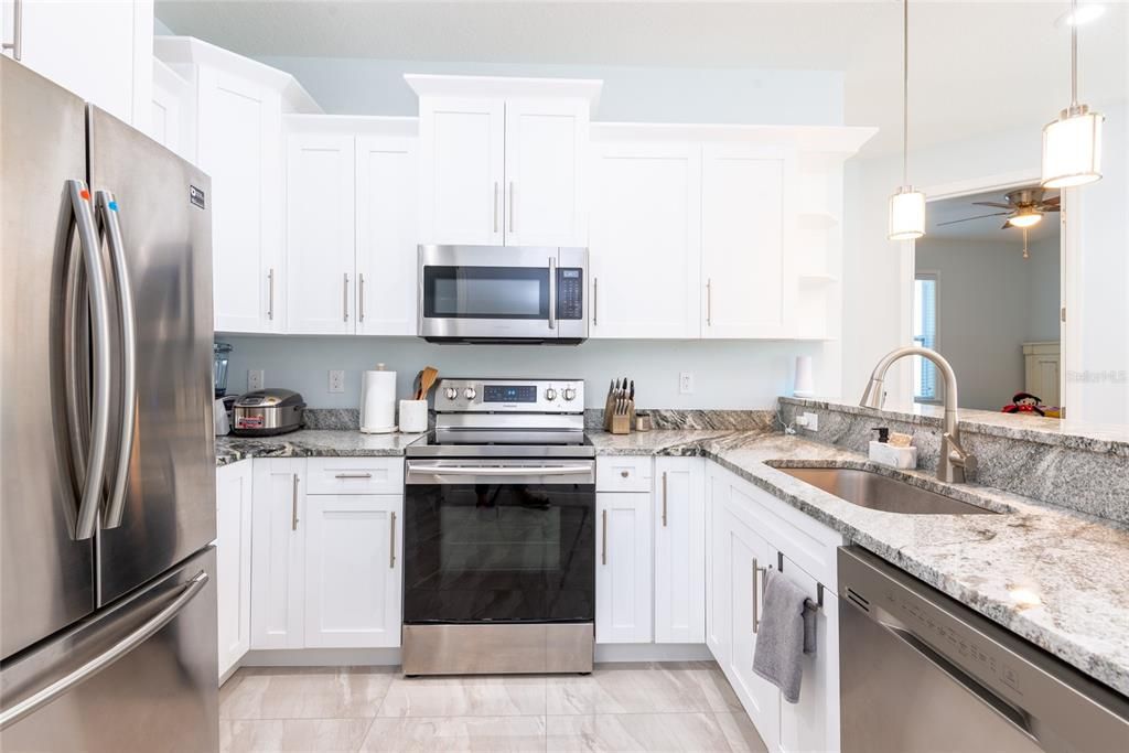 granite counter top kitchen with stainless steel appliances