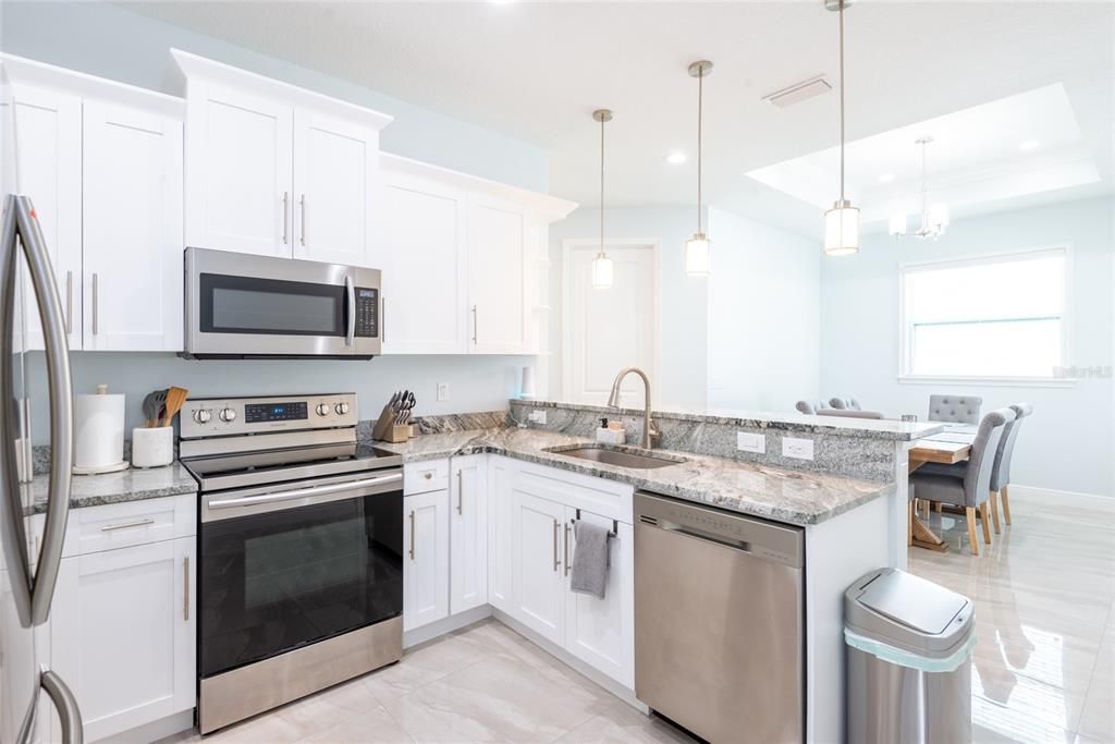 granite counter top kitchen with stainless steel appliances