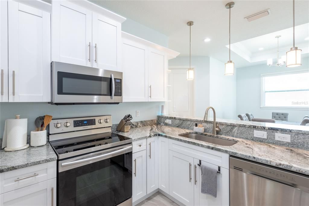 granite counter top kitchen with stainless steel appliances