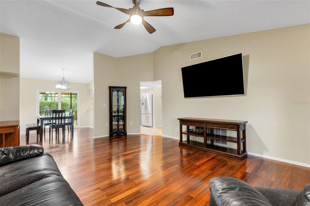 looking from front corner of living room to dining room and kitchen