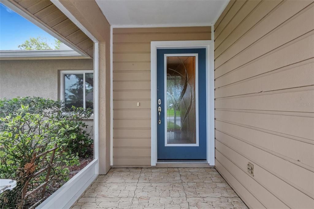 front porch with beautiful glass impact front door