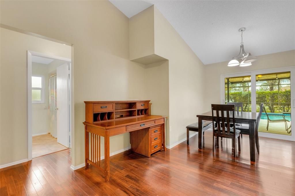 standing in living room; showing desk nook, dining room and hallway to additional bedrooms and second bath