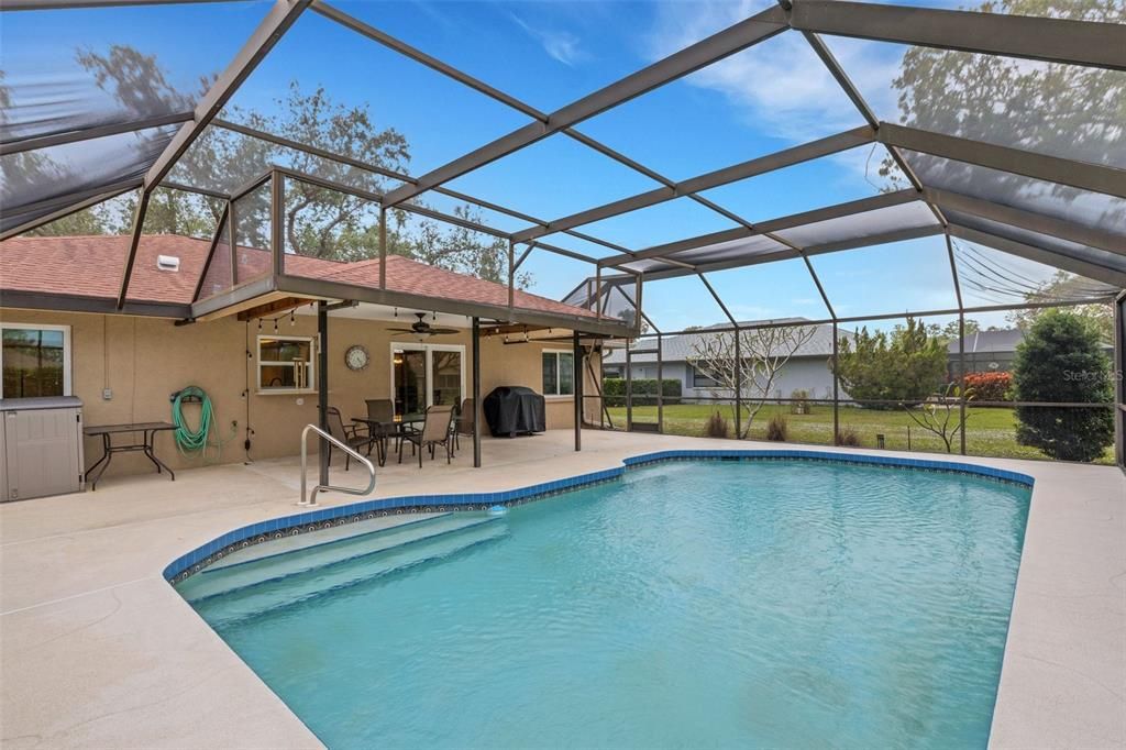 looking from the corner of the pool cage back to the home