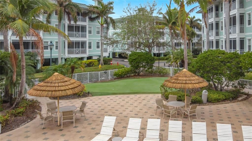 loungers and tables by pool