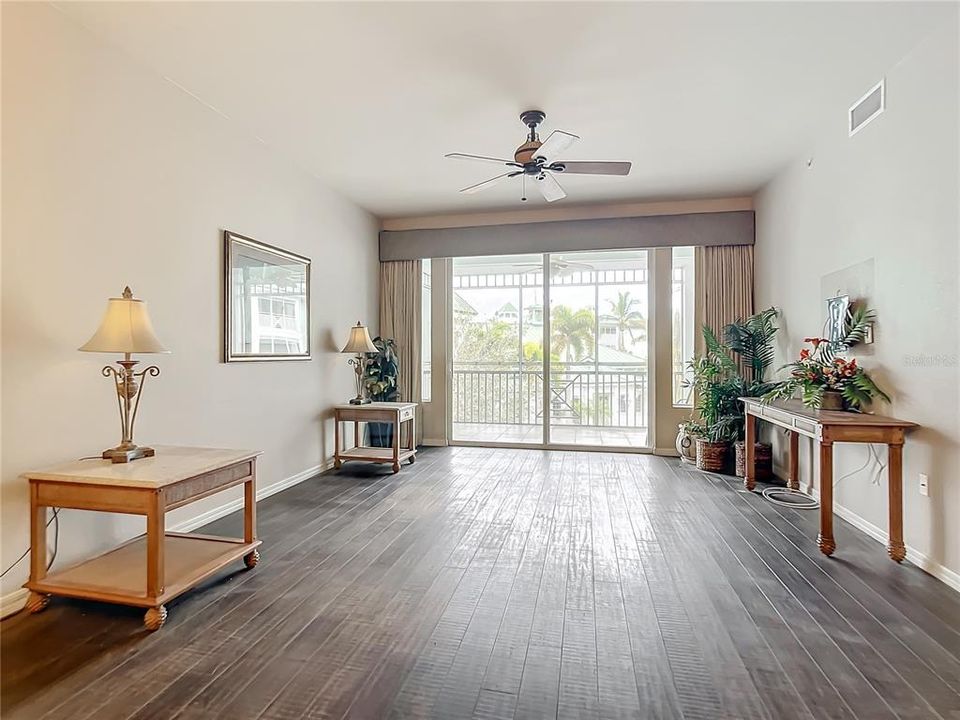 Great room with sliders to screened balcony