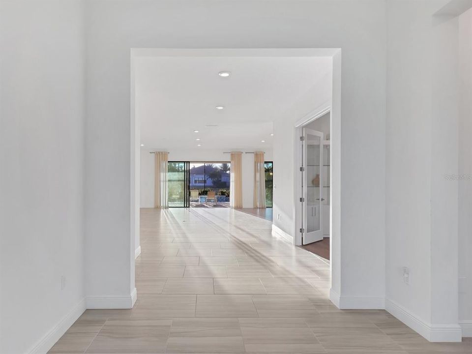 inside Foyer looking through to triple sliders at lanai