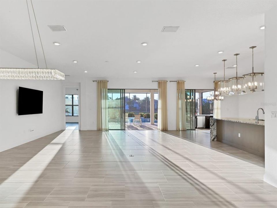 Formal dining area chandelier peeking through on left.