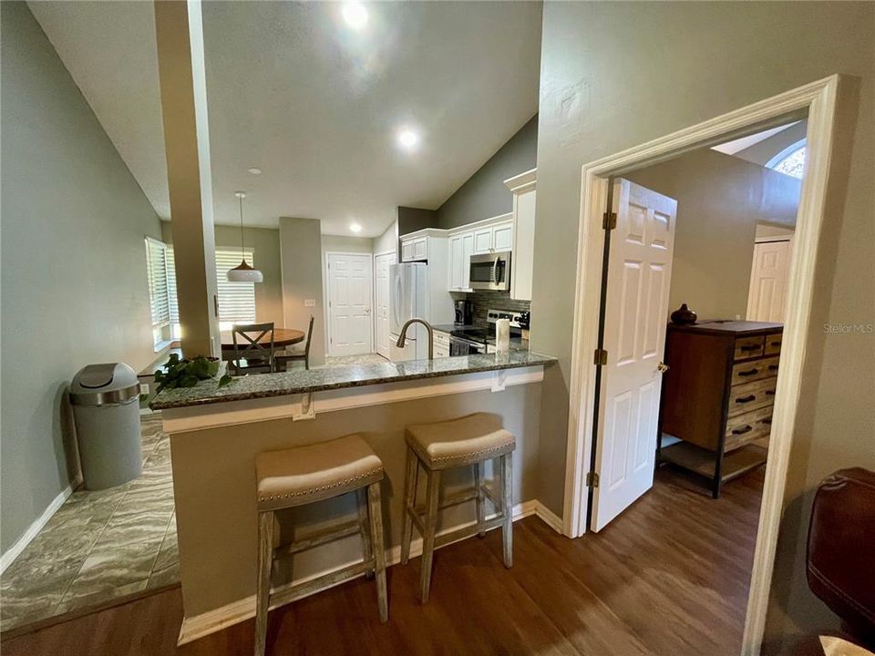 Fabulous open upscale kitchen with eat in kitchen, bar, pantry and laundry and of course entry/exit to spacious 2 car garage.