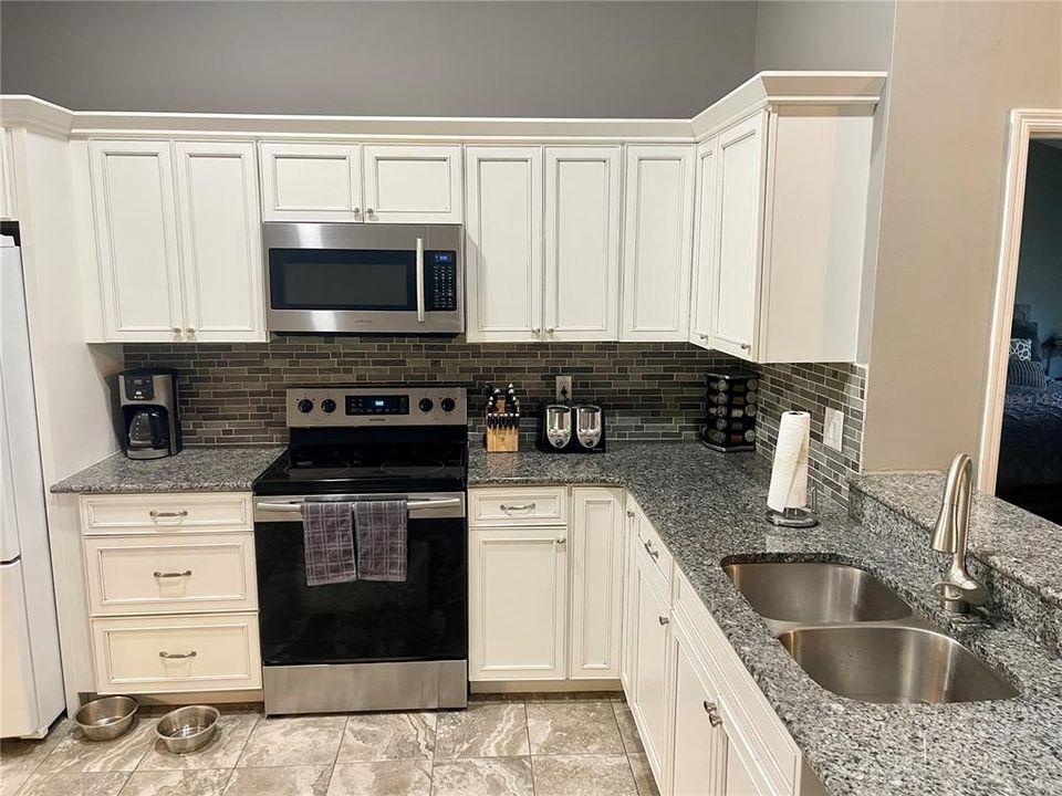 Kitchen renovation in 2019Granite countertops with custom tile backsplash