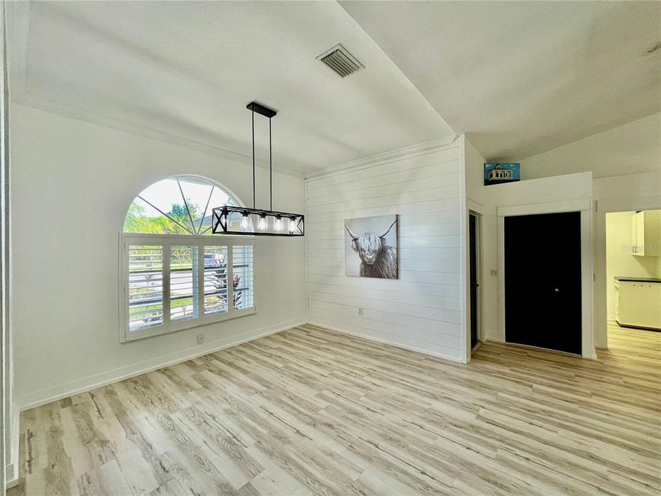 Dining room is in the front of the home.  The black doors are to the garage and a closet.