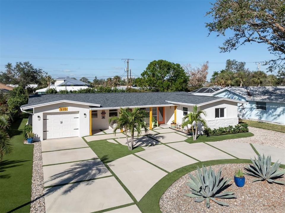 Circular driveway, garage, and easy to maintain landscape.