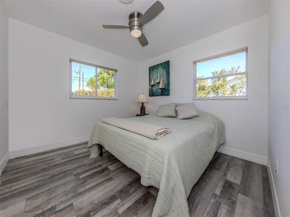 Second formal bedroom. Has high quality Levolor cellular shades for privacy and temperature control. A large closet with custom cabinetry inside. Ceiling fan to move air for added comfort.