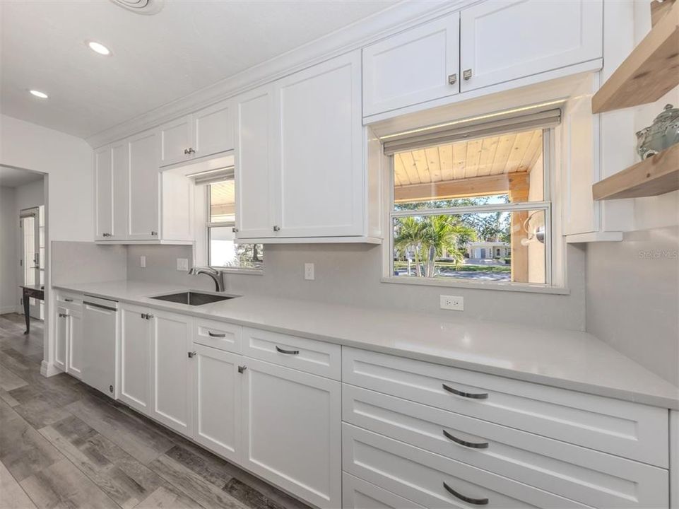 Modern kitchen with luxury quality quartzite counters, lots of soft close cabinetry and built-in features.