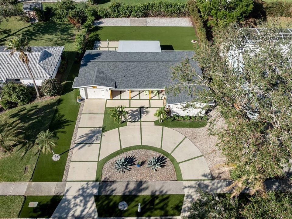 Aerial view of home on spacious 1/4 acre lot.