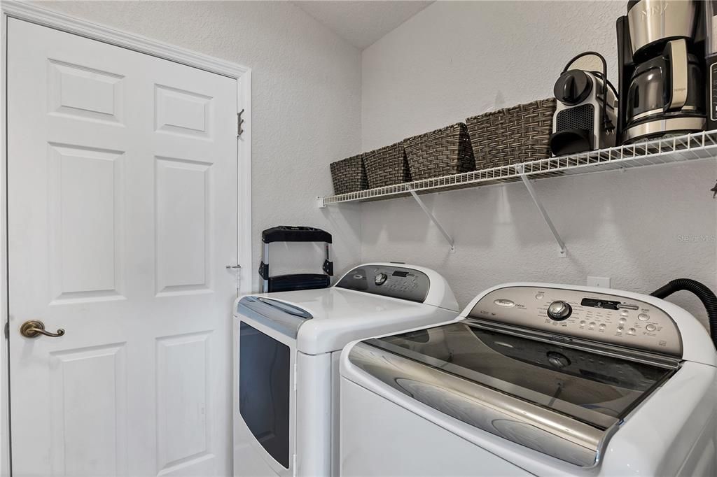 Laundry room and door leading out to the garage.