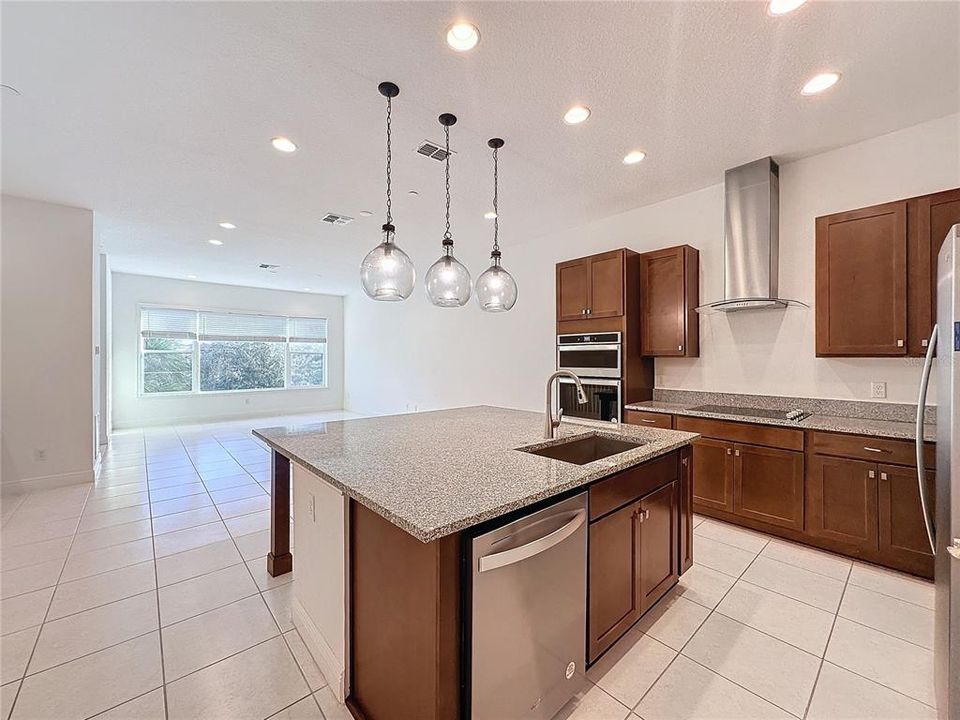 Kitchen with granite countertop & pendant lighting