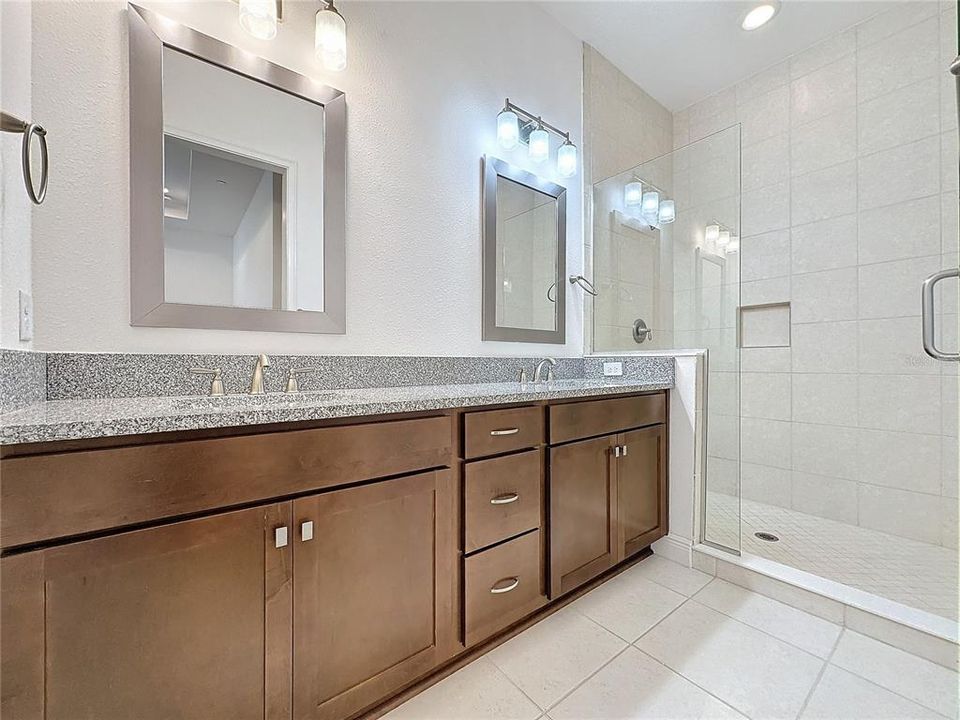 Primary Bathroom w/semi-frameless oversized walk in shower & dual sinks