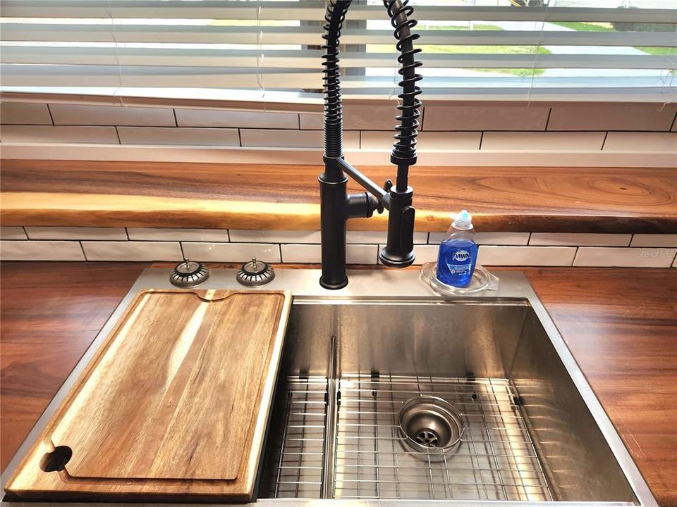 new double sink and a cutting board