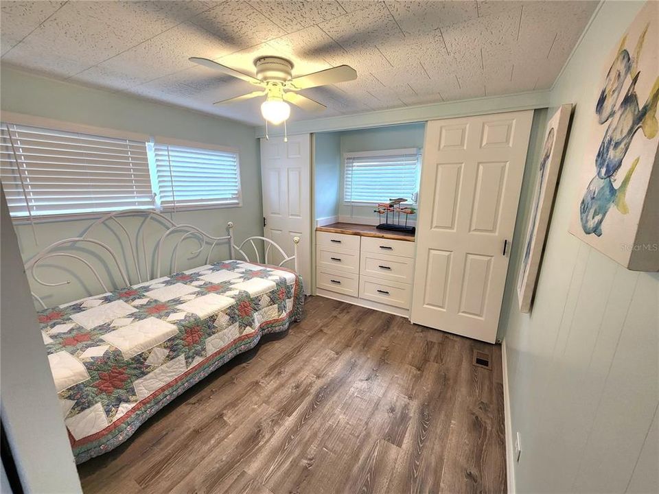 bedroms have ceiling fan, a built in dresser and 2 closets