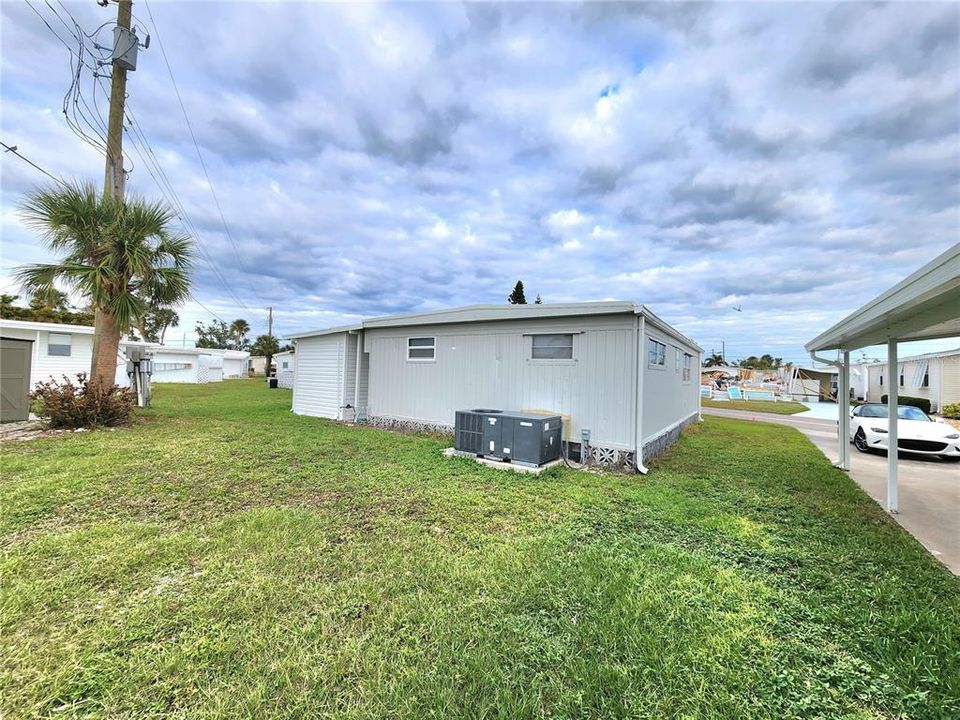 back yard and AC unit.  This home has central air and a few window units in case you want your bedroom cooler than the rest of the home.