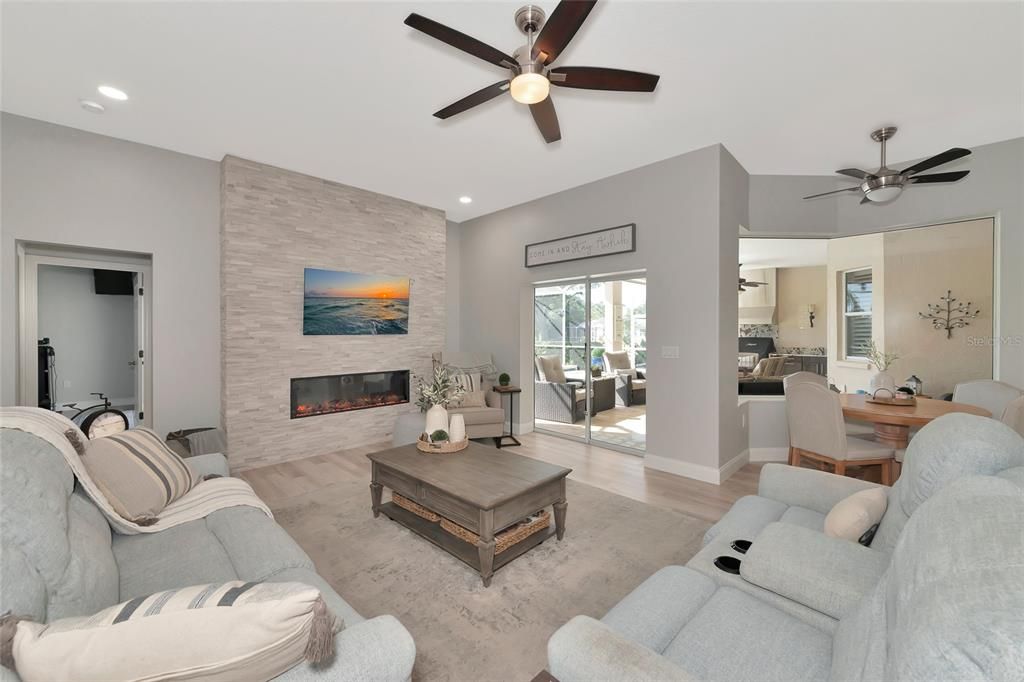 What an amazing family room, dining nook and sliding door access to the covered lanai