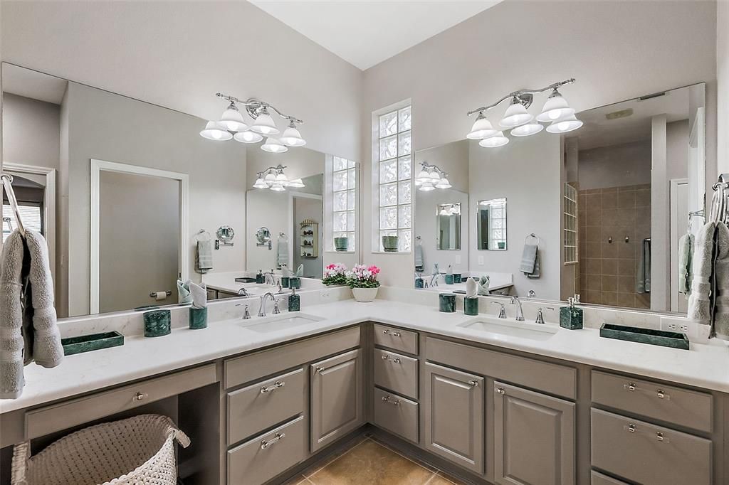 Primary bathroom with dual sink vanity. Updated quartz counters, lighting and fixtures.