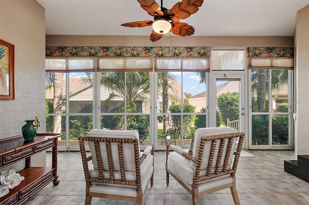 Climate controlled (heated/cooled), enclosed lanai with tiled floor and solar shades.