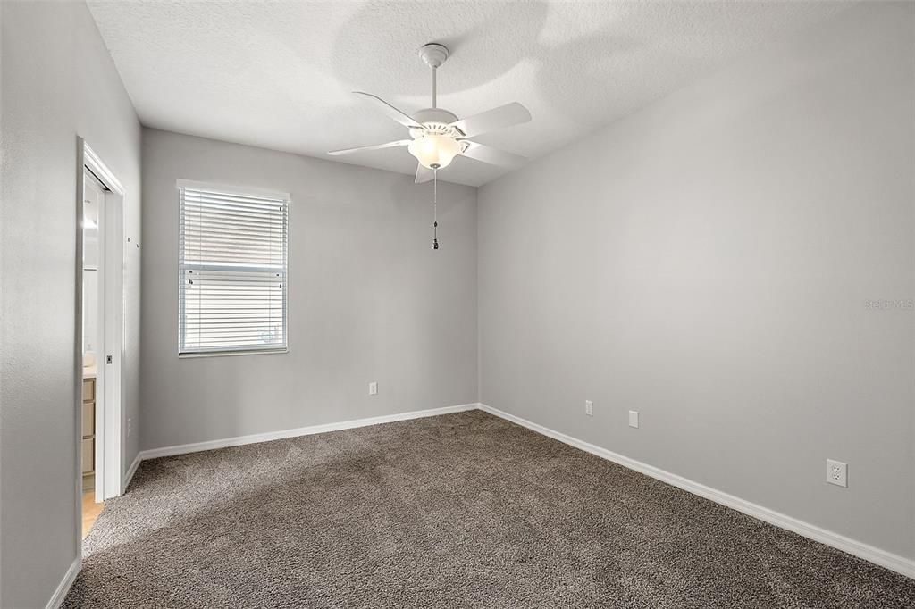 Bedroom 3 with Jack & Jill bath.  Custom closet.