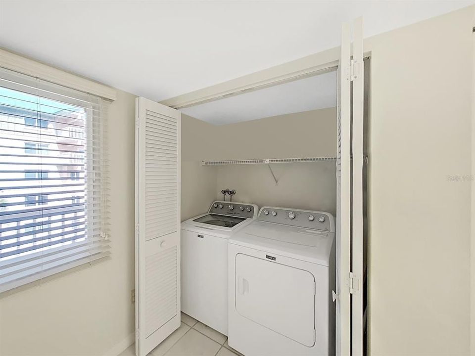 Washer and Dryer are in the kitchen, tucked in their closet!