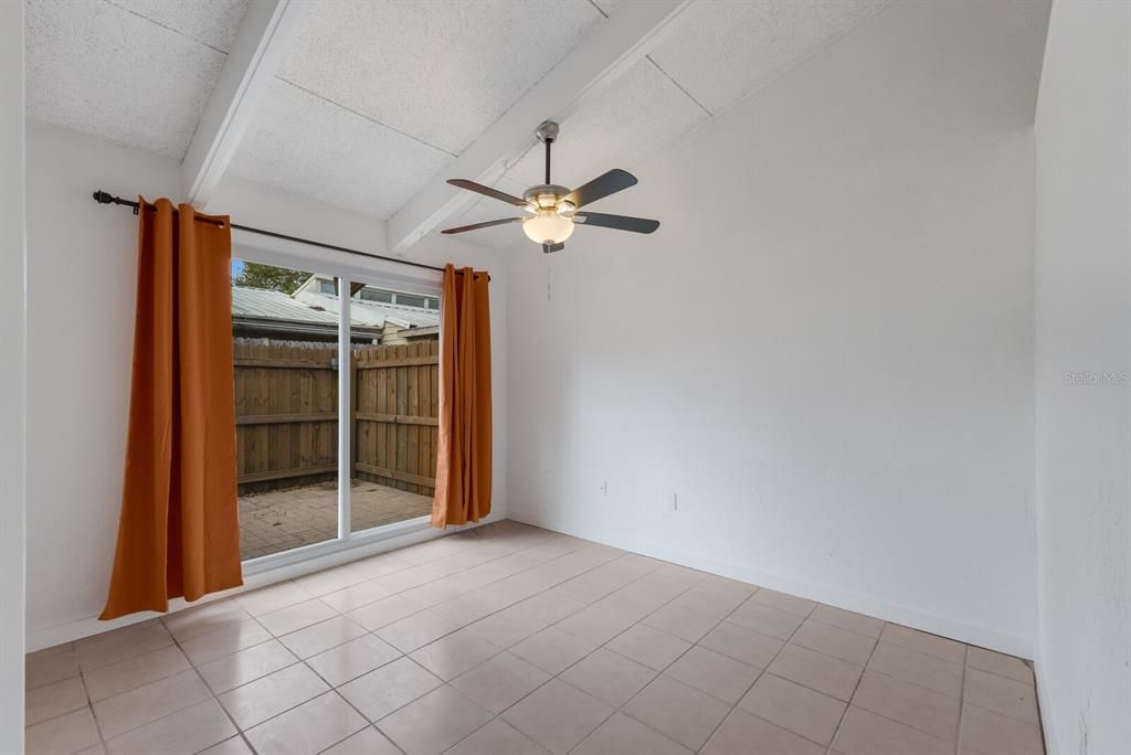 Second bedroom with sliding doors to back patio