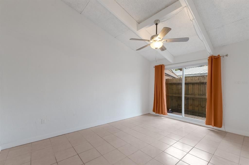 Large bedroom with sliding doors to second patio