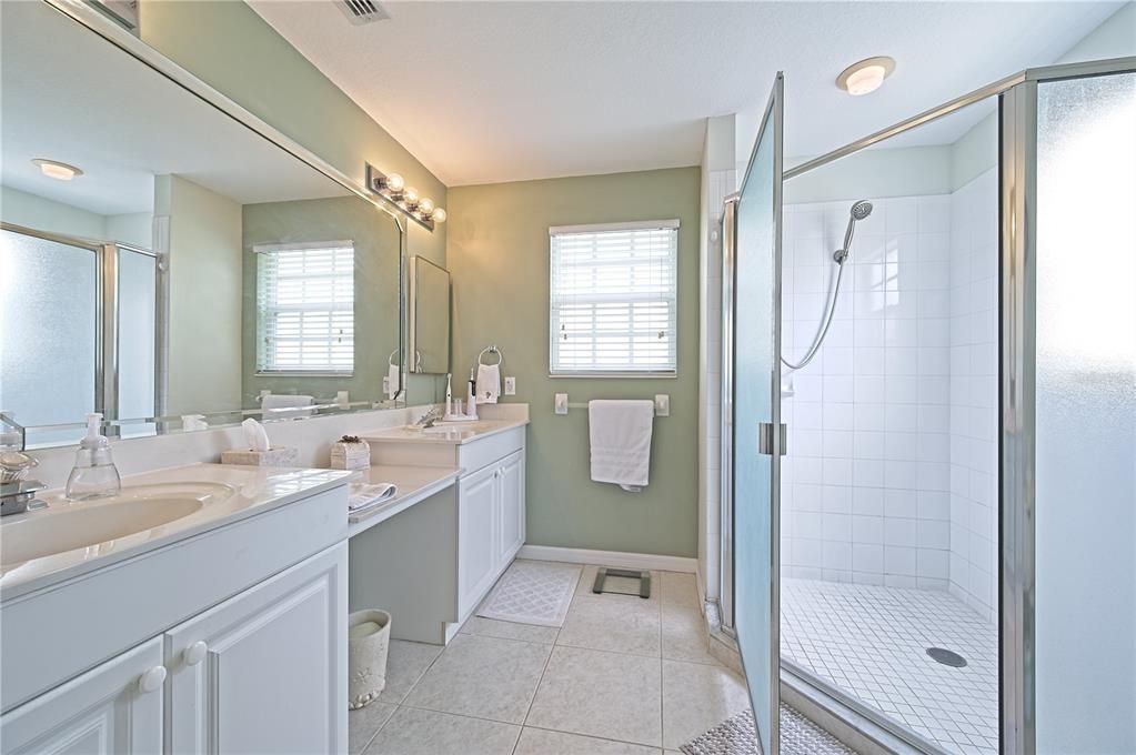 Primary bathroom with dual vanities