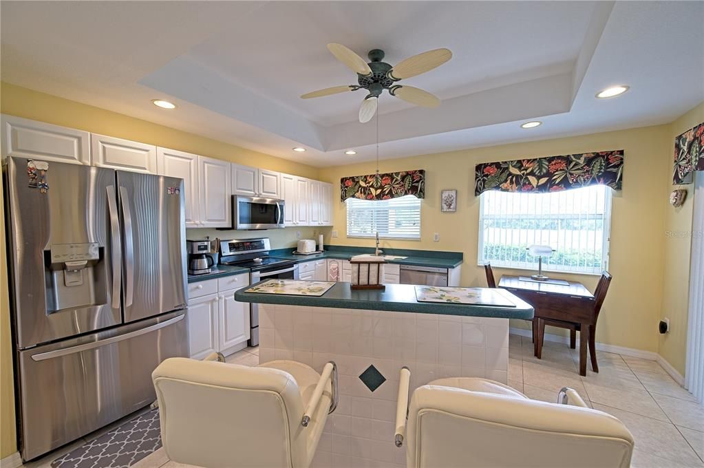 Kitchen with windows facing lake view