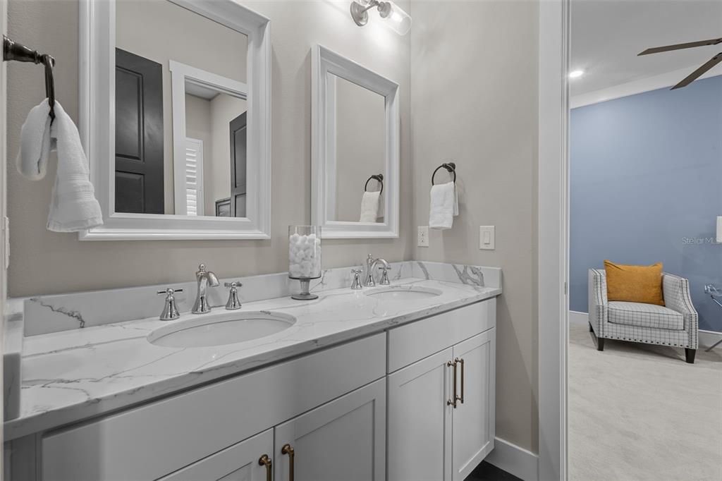 Full Bathroom - jack and jill style between bedroom 2 and 3 with shower/bath combo and double sinks with quartz counters