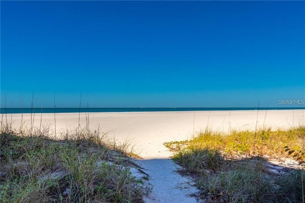 Beach just one step from The Sand Key Club