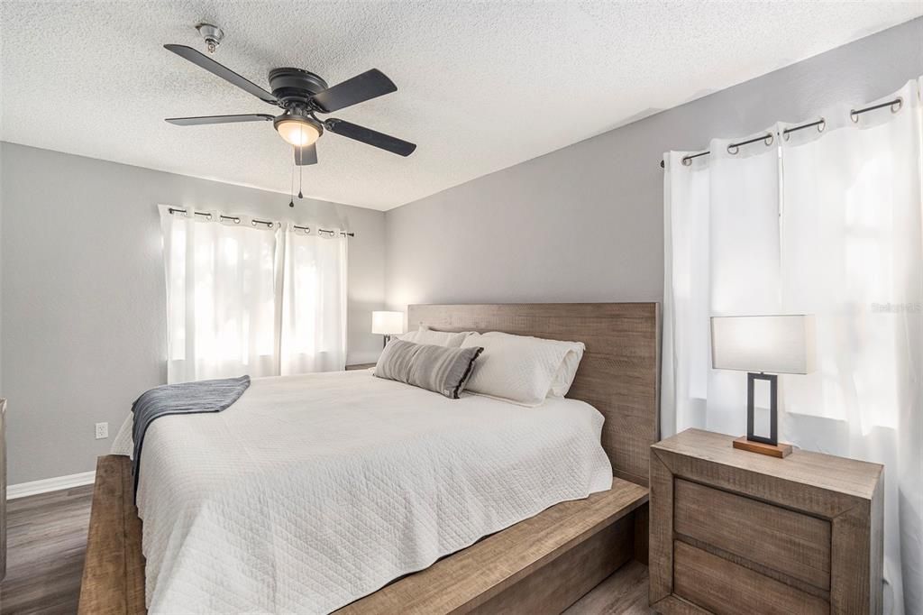 Primary bedroom fits a king bed and two large nightstands.