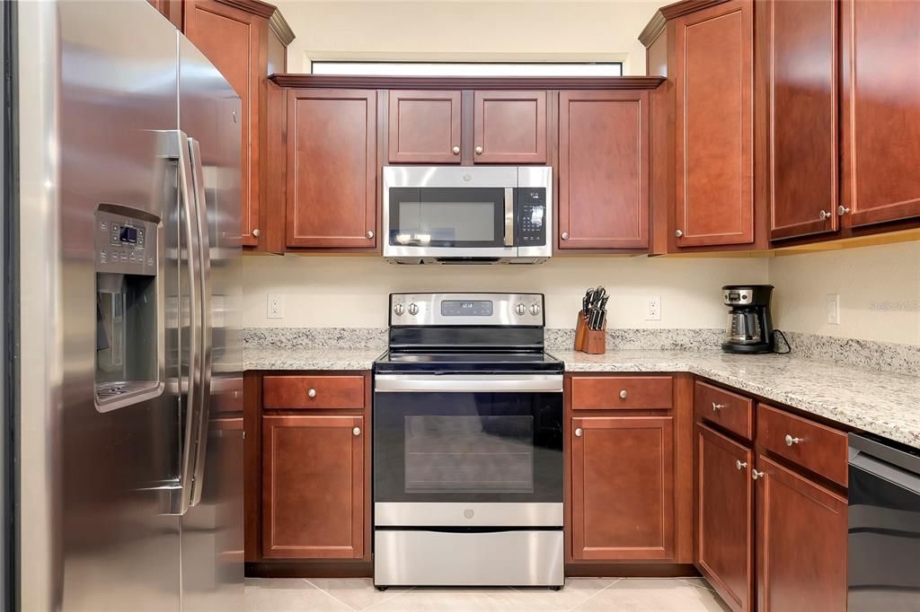 Kitchen with wood cabinets and granite countertops