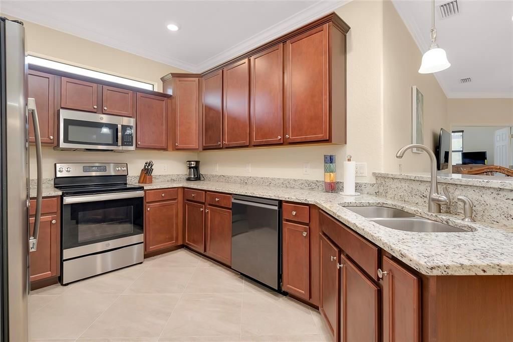 Kitchen with wood cabinets and granite countertops