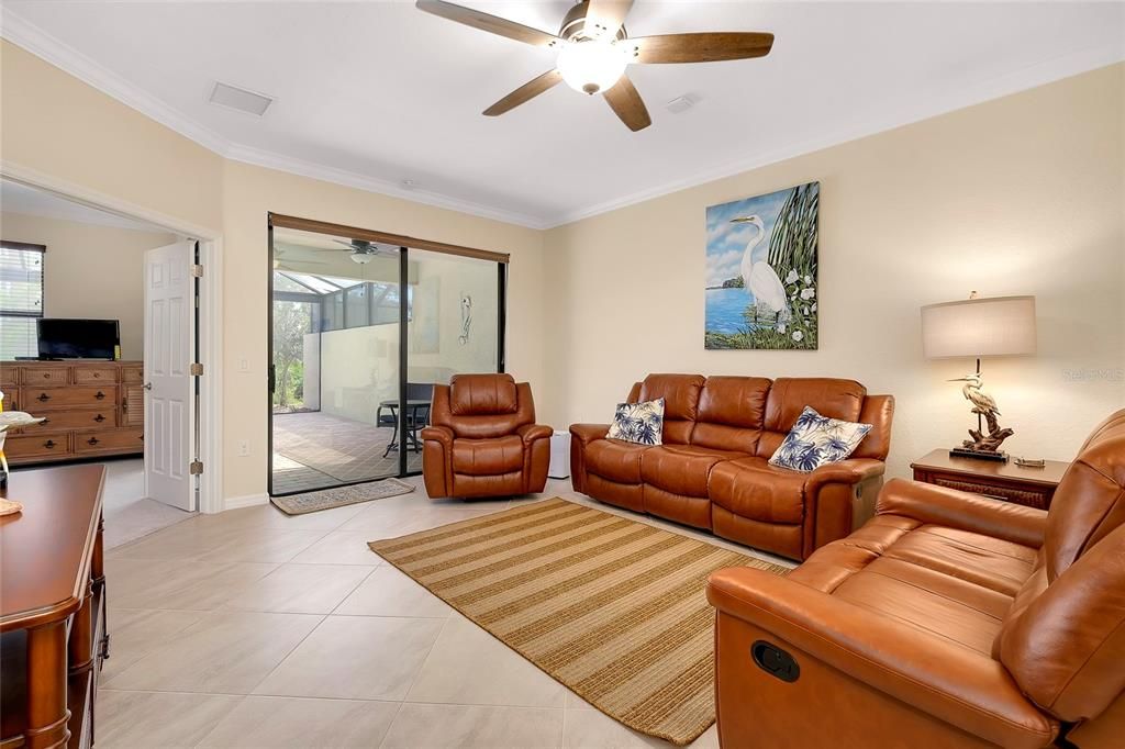 Living room with sliders to enclosed Lanai