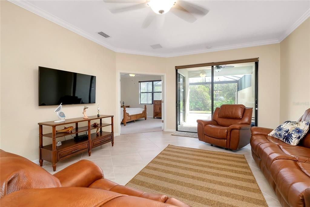 Living room with sliders to enclosed Lanai