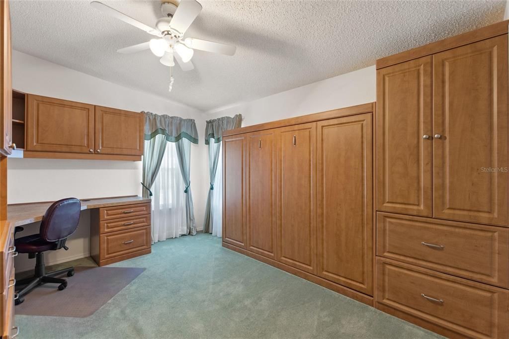 Bedroom Three with built in cabinets and Murphy bed