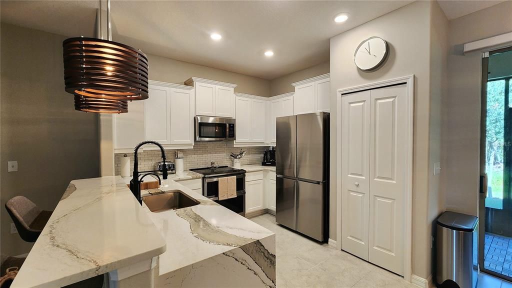 Kitchen with upgraded appliances and Quartz Countertops