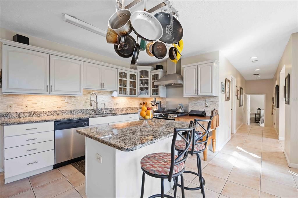 Beautiful backsplash and tile flooring in the kitchen