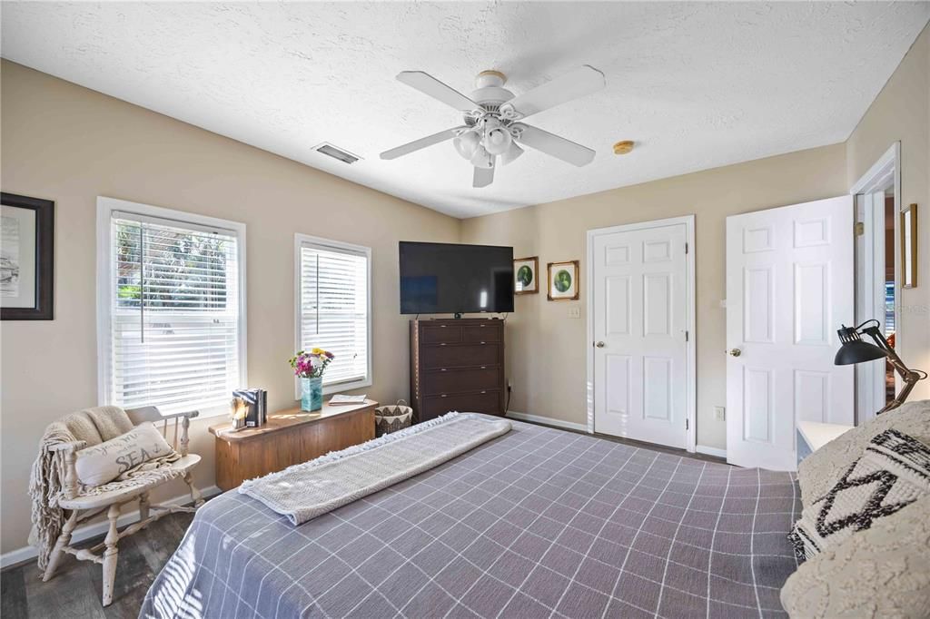 Walk-in closet in the main bedroom with a barn door