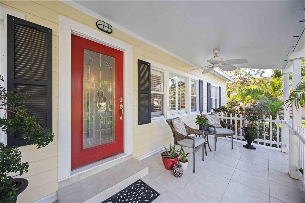 The open front porch features tile flooring