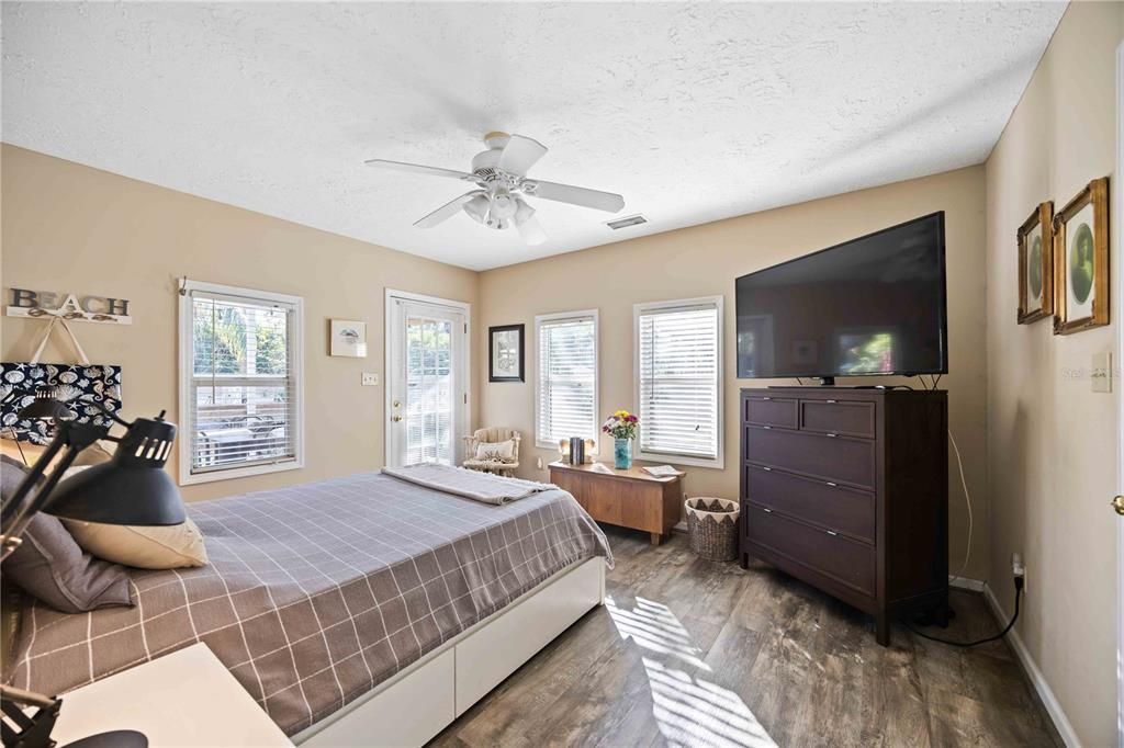 Main bedroom with luxury vinyl flooring in gray tone