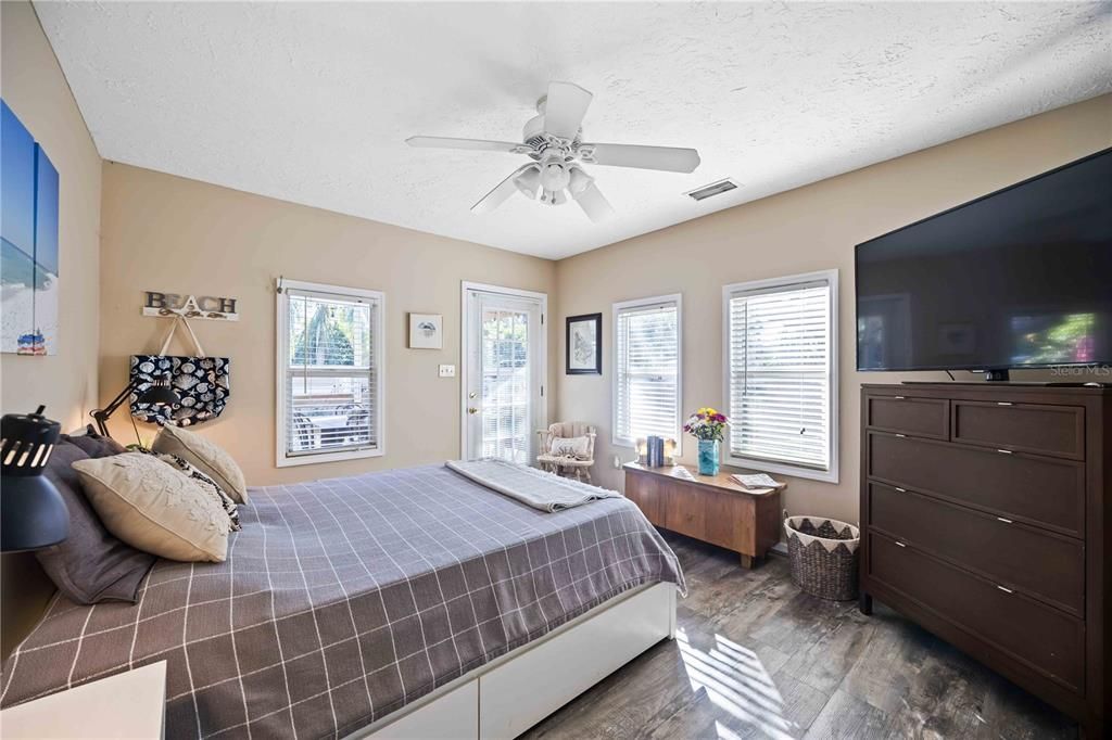 Primary bedroom with a ceiling fan