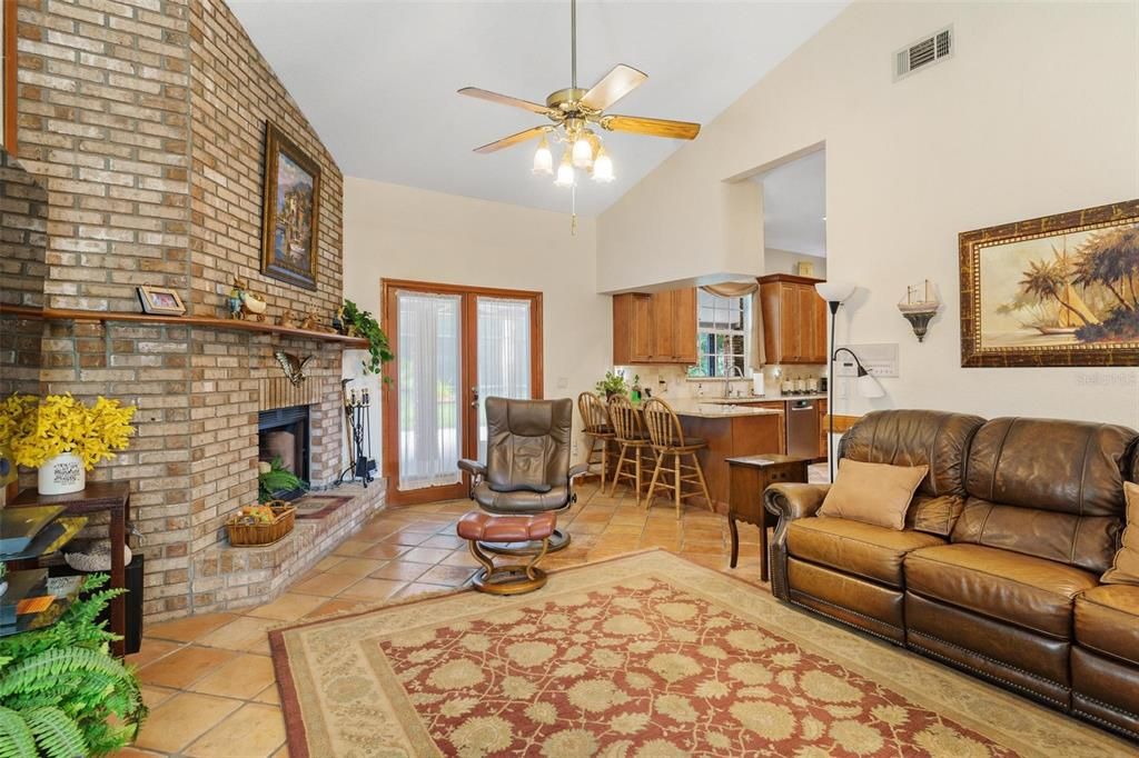 Family Room with Brick  Wood Burning Fireplace